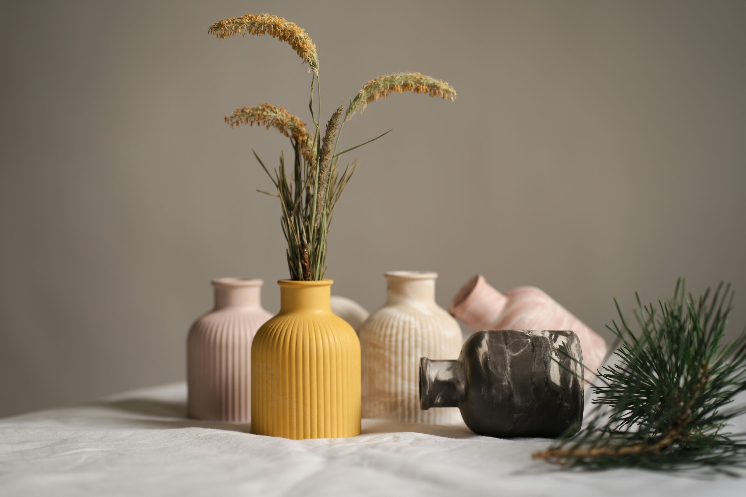 A group of vases sitting on top of a bed