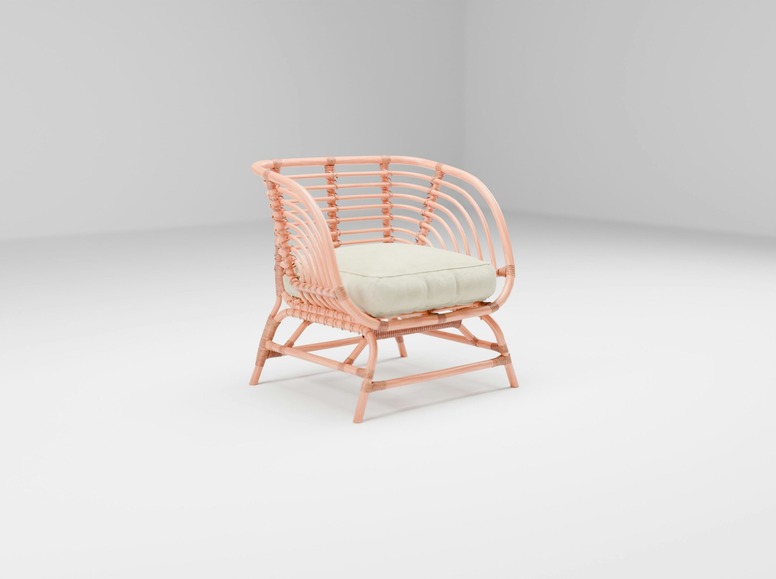 A pink chair with a white cushion on it